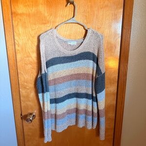 This item is a Knox Rose striped V-neck pullover sweater featuring a neutral-ton